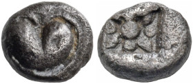 KYRENAIKA. Kyrene. Circa 500-480 BC. Hemiobol (Silver, 5.5 mm, 0.32 g). Silphium fruit with point downwards. Rev. Four pointed star formed by four lot...