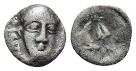 Italy. Southern Campania, Phistelia, c. 325-275 BC. AR Obol (10,1mm, 0.6g). Male head facing slightly r. R/ Dolphin, barley grain, and mussel shell. R...