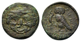 Sicily, Kamarina, c. 420-405 BC. Æ Tetras (14.2mm, 3.3g). Facing gorgoneion. R/ Owl standing left, head facing, holding lizard in talon; three pellets...