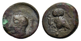 Sicily, Kamarina, c. 420-405 BC. Æ Onkia (10.9mm, 1.1g). Helmeted head of Athena left. R/ Owl standing left, head facing, grasping lizard; pellet (mar...