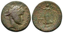 Sicily, Katane, c. 200 BC. Æ (22mm, 8.9g). Head of Hermes right, wearing winged petasos. R/ Nike advancing left, holding wreath and palm; two monogram...