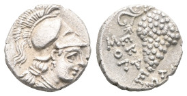 Greek coins Cilicia, Soli AR Obol (Silver) ca 350-330 BC. Obv: Head of Athena right in crested Corinthian helmet; dotted border Rev: ΣOΛEΩN, bunch of ...