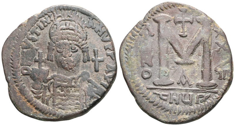 Justinian I AE Follis (Bronze) Antioch. Obv: DN IVSTINIANVS PP AVG, helmeted and...
