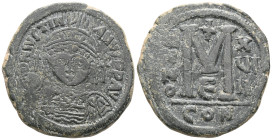 Justinian I. 527-565. Æ Follis . Constantinople mint. Dated RY 18 (544/5). Helmeted facing bust, holding globus cruciger and shield; cross to right / ...