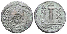 JUSTINIAN I. 527-565 AD. Æ Decanummium Antioch mint. Dated RY 38 (564/5 AD). Helmeted facing bust, holding globus cruciger; cross in right field / Lar...