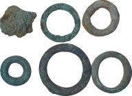 Celtic World. Multiple lot of five (5) 'proto money' bronze rings and an aes rudae. Weights: from 29 to 10 g. Dimensions: from 44 to 25 mm. AE.