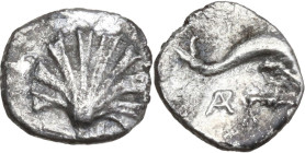Greek Italy. Southern Apulia, Tarentum. AR Litra, 325-280 BC. Obv. Scallop shell. Rev. Dolphin right; below, monogram. HN Italy 979; HGC 1 846. AR. 0....