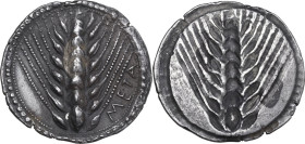 Greek Italy. Southern Lucania, Metapontum. AR Nomos, c. 540-510 BC. Obv. ΜΕΤΑ to right. Ear of barley with seven grains. Rev. Incuse ear of barley wit...