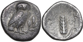 Greek Italy. Southern Lucania, Metapontum. AR Drachm, c. 325-275 BC. Obv. Owl standing right, head facing, on olive spray. Rev. META. Barley ear with ...