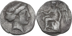 Greek Italy. Bruttium, Terina. AR Drachm (?), c. 350-300 BC. Obv. Head of the nymph Terina right. Rev. Nike seated left on plinth, holding out right h...