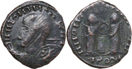 Uncertain Germanic tribe. Pseudo-Imperial coinage. AE, Barbaric imitation. Obv. Helmeted and cuirassed bust left, with shield and spear. Rev. Two Vict...