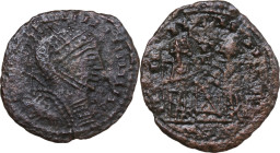 Uncertain Germanic tribe. Pseudo-Imperial coinage. AE, Barbaric imitation. Obv. Helmeted and cuirassed bust right, with shield and spear. Rev. Two Vic...