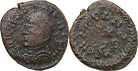 Uncertain Germanic tribe. Pseudo-Imperial coinage. AE, Barbaric imitation. Obv. Helmeted and cuirassed bust left, with shield and spear. Rev. Letters ...