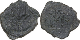 Tiberius III, Apsimar (698-705). AE Follis. Syracuse mint, 698-701 AD. Obv. Crowned and cuirassed bust facing, holding spear and shield decorated with...