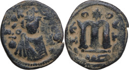 Arab-byzantine, Umayyad Caliphate, pre-reform coinage. AE Fals, Emesa mint, 41-77 H / 661-697 AD. D/ Facing bust of Byzantine emperor, holding globus ...