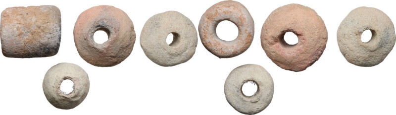 FOUR POTTERY WEIGHTS Greek World, c. 6th - 2nd century BC. Lot of four (4) potte...