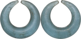 ANCIENT GLASS EARRING South East Asia, Vietnam or Cambodia, c. 3rd - 1st century BC. Light blue glass earring, with thicker body and thin ends. Dimens...