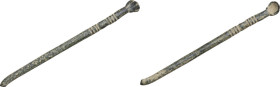 ROMAN SURGICAL SPATULA Roman period, c. 1st - 4th century AD. Bronze surgical spatula with long handle and small concave head. Decorated with engraved...