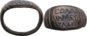BYZANTINE INSCRIBED RING Byzantine, c. 7th - 8th century AD. Byzantine bronze ring with Greek inscription on three lines, framed by two pairs of verti...