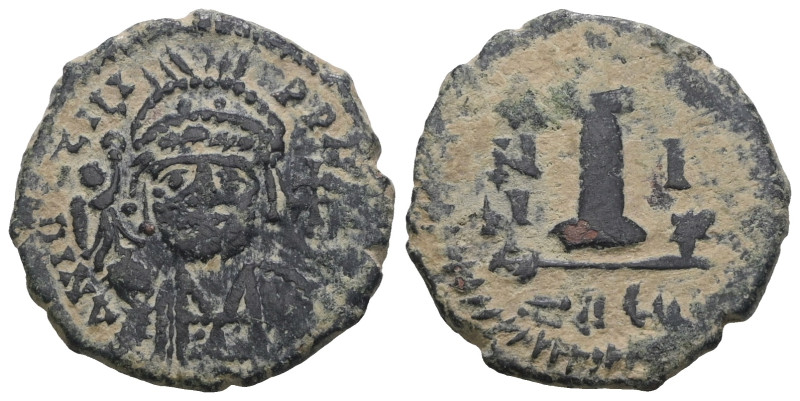 Justinian I. (527-565 AD) Æ 10 Nummi. Theoupolis. Obv: crowned bust facing. Rev:...