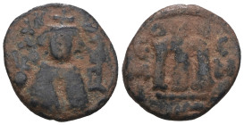 Arab-Byzantine. Umayyad Caliphate. 'Abd al-Malik ibn Marwan. (685-705 AD). Follis. Emesa. Obv: emperor facing holding golbus cruciger. Rev: M. artific...