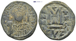 Justinian I. Æ Follis (34mm, 16.46 g), 527-565. Cyzicus, RY 29 (555/6). Helmeted and cuirassed bust of Justinian I facing, holding globus cruciger and...