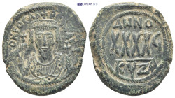 Phocas AD 602-610. year 6 (607/8). Cyzicus Follis Æ (29mm., 12.3 g). Crowned facing bust, wearing consular robes, holding mappa and eagle sceptre with...