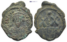 Phocas AE Half Follis (25mm, 5.1 g) 602-610 AD. DN FOCA PERP AVG, crowned and mantled bust facing, holding mappa and cross / Large XX, star above.