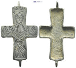 Bronze reliquary cross pendant. Jesus Christ on the cross, dressed with a long robe (sticharion) and two flanking small figures (23 Gr. 65mm.) SOLD AS...