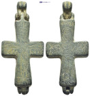 Byzantine Reliquary Cross Pendant. A bifacial bronze reliquary cross pendant comprising two decorative plates, complete hinge below and large suspensi...