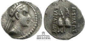 BAKTRIA, Graeco-Baktrian Kings. Eukratides I. Circa 171-145 BC. AR Obol. Draped bust right / Caps of the Dioskouroi; monogram below. 12 mm, .65 g.