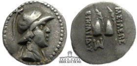 BAKTRIA, Greco-Baktrian Kingdom. Eukratides I. Circa 170-145 BC. AR Obol. Diademed, helmeted and draped bust right / Caps of the Dioskouroi and palms;...