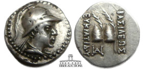 BAKTRIA, Greco-Baktrian Kingdom. Eukratides I. Circa 170-145 BC. AR Obol. Diademed, helmeted and draped bust right / Caps of the Dioskouroi and palms;...