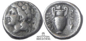 THESSALY, Lamia. Circa 400-350 BC. AR Hemidrachm. Head of young Dionysos left, wearing ivy wreath / Amphora; ivy leaf above; to right, prochous with h...