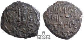Artuqids of Mardin. Nasir al-Din Artuq Arslan. Æ Dirham. Mardin mint, AH 633 = AD 1235-1236. Crude short curly haired head facing, almond eyes, margin...