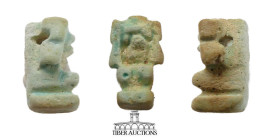 Pharaonic Egypt. Amulet of Shu. Late Period. 664–332 B.C. Faience figure with glaze, featuring Shu kneeling and holding up the sky. Intact with hole a...