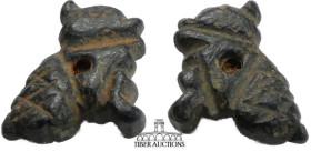 Near East. Bronze amulet of a dog. 1st Millennium BC. Pierced for mounting. 15 mm, 7 mm, .87 g.