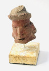 Precolumbian, Mexico. Terracotta Head. Circa 1st 8th century AD - 800 AD. 50 mm x 28 mm, 82.90 g. with stand.