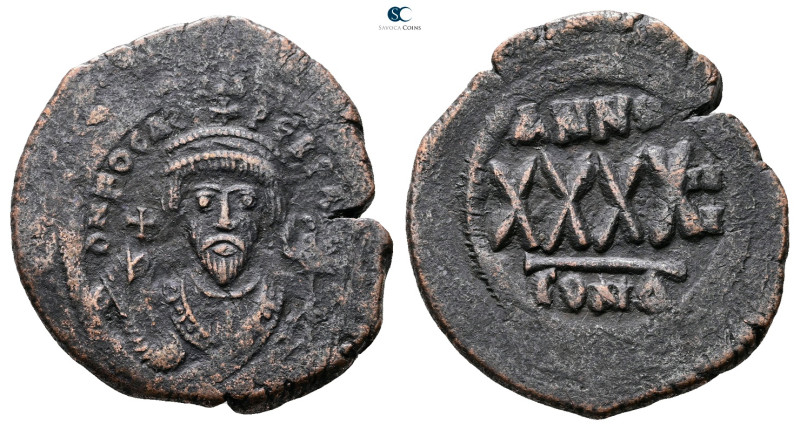 Phocas AD 602-610. Constantinople
Follis or 40 Nummi Æ

32 mm, 13,19 g


...