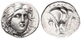 Caria, Rhodes. AR, Drachm. 5.54 g. - 19.21 mm. Circa 305-275 BC.
Obv.: Head of Helios facing, turned slightly right, hair parted in center and swept t...