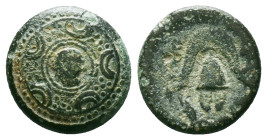 Greek
Kings of Macedon, Alexander III "the Great" (336-323 BC) AE Uncertain mint in Western Asia Minor.
Obv: Macedonian shield; facing head of Herakle...