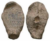 Ancient Byzantine Coins - Lead Inscription Seal
7th-9th century AD. A lead uniface seal with monogram above inscription in four lines. 2.59 grams. 
...
