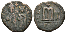 PHOCAS.(602-610).Antioch.Ae.

Obv : ∂ N FOCA NЄP ЄAV.
Phocas and Leontia standing facing, holding globus cruciger and cruciform sceptre respectively; ...