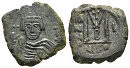 HERACLIUS (610-641).Nicomedia.Follis.

Obv : Helmeted and cuirassed bust facing, holding globus cruciger and shield decorated with horseman motif.

Re...