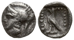 ASIA MINOR. Uncertain. (Circa 5th-4th centuries BC).
AR Tetartemorion (6.2mm 0.12g)
Obv: Head of Athena right, wearing Attic helmet
Rev: Bird stand...