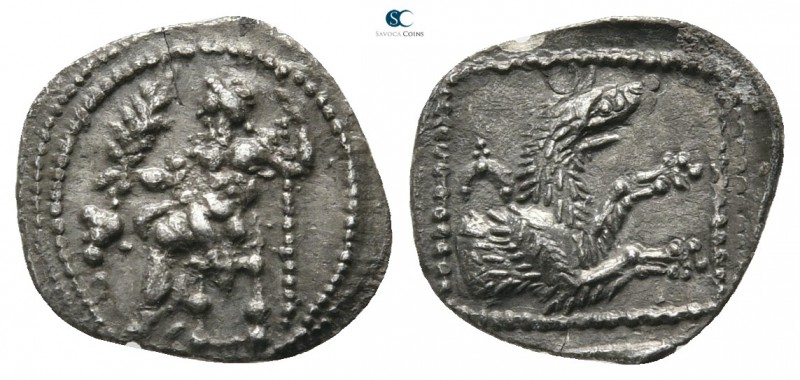 Lycaonia. Laranda 324-323 BC. 
Obol AR

12 mm., 0,57 g.

Baaltars seated le...