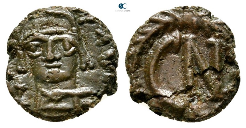 Justinian I AD 527-565. Carthago
Nummus Æ

10 mm., 0,96 g.

Crowned facing ...