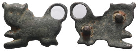 Weight 5,14 gr - Diameter 26 mm. Bronze fitting, late Byzantine-early Islamic, lion/panther standing to the left, bent tail, fastening eyelets on the ...