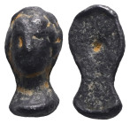 Weight 6,31 gr - Diameter 19 mm. Face figure made of lead casting. Black patina.