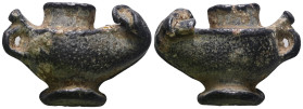 Weight 21,48 gr - Diameter 33 mm. Pilgrim's Holy Water Ampulla with inscription on, 10th-14th century AD. A lead-alloy ampulla with tapering body, fla...